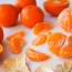 a group of oranges on a white surface