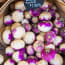 a pile of purple and white turnips