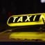 a taxi sign on a car