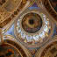 a ceiling with gold trim and paintings