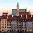 a group of buildings with red roofs