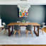 a dining room table with chairs and a chandelier