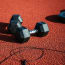 a pair of weights on a red surface