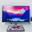 a computer screen with mountains and a sunset