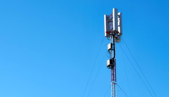 a tower with antennas and wires