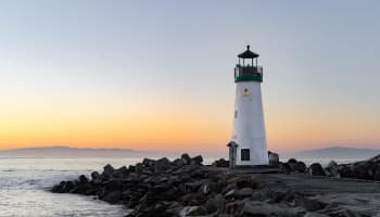 a lighthouse on a rocky shore