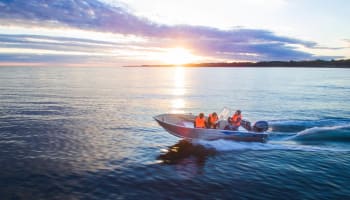 a group of people in a boat on water