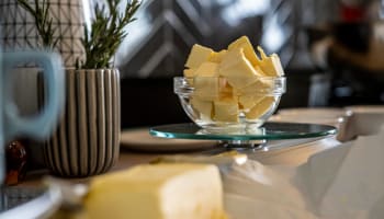 a bowl of butter on a table
