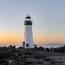 a lighthouse on a rocky shore