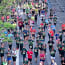 a group of people running on a street