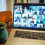 a laptop computer with a mug of coffee