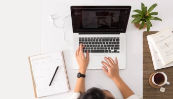 a person typing on a laptop