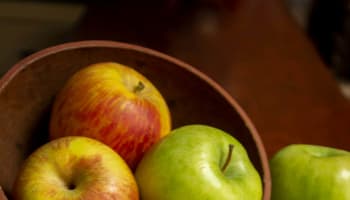 a group of apples in a bowl