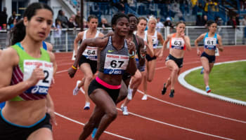 a group of people running on a track