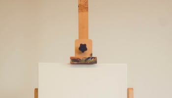 a painting stand with a white board