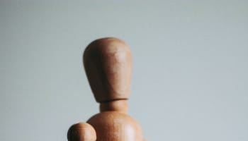 a wooden figure of a person