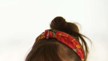 a person with a straw in her mouth