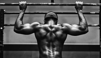 a person holding up a bar