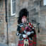 a person playing bagpipes outside