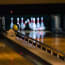 a bowling alley with bowling pins and a ball