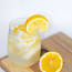 a lemon cut in half on a wooden surface