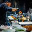 a person cooking food in a kitchen