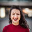 a person with red lipstick smiling