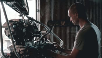 a person working on a motorcycle