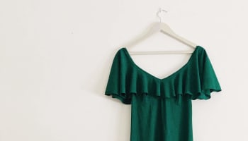 a green dress on a hanger