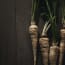 a group of parsnips with green stems