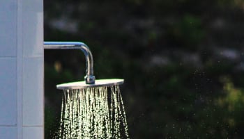 a shower head with water running out of it