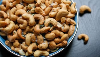 a bowl of cashews with salt and rosemary