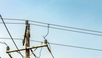a wooden pole with wires