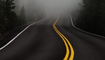 a road with a yellow double line