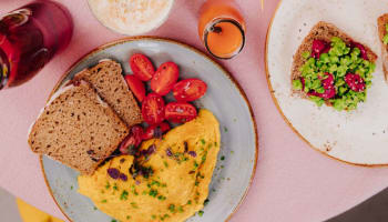 a plate of food and a cup of coffee