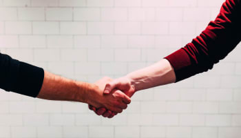 a close up of a handshake