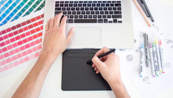 a person using a stylus on a laptop