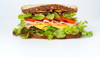 a sandwich with meat and vegetables