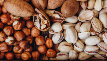 a group of nuts and pistachios