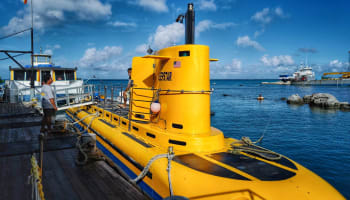 a yellow submarine on a dock