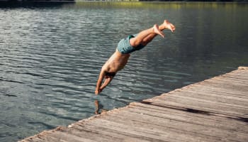 a person diving into a lake