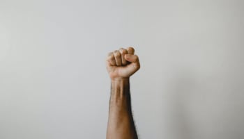 a hand with a fist raised