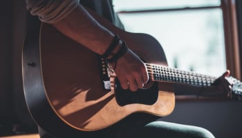 a person playing a guitar