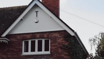a brick chimney with smoke coming out of it