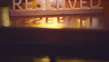 a wooden sign with letters on a table