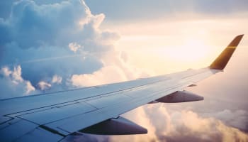 the wing of an airplane in the sky