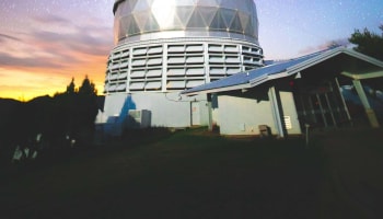 a large dome shaped building with a roof