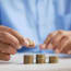 a person stacking coins