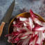 a bowl of red and white vegetables