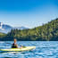 a person in a kayak on a lake